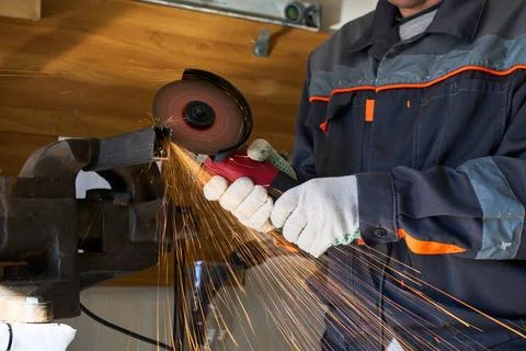 Cutting metal with an angle grinder Stock Photos