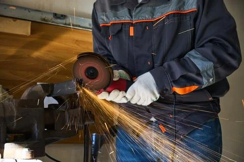 Cutting metal with an angle grinder Stock Photos