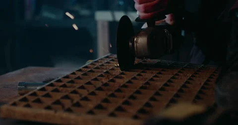 Cutting metal with angle grinder.  Sparks fly at camera. Slo-mo Stock Footage 265259719