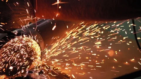 Cutting metal with disc grinder with bright sparks Stock Footage 80831974