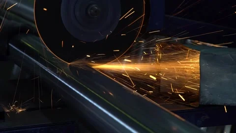 Cutting metal with a disc in the workshop. Worker cuts iron pipe with lathe Stock Footage 237802872