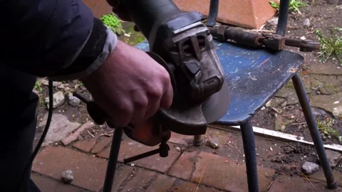 Cutting metal with a grinder Stock Footage 306782507