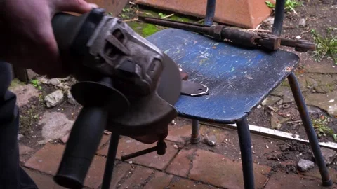 Cutting metal with a grinder Stock Footage 306782508