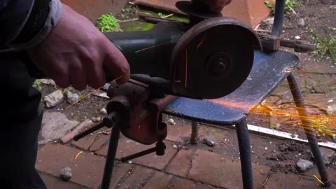 Cutting metal with a grinder Stock Footage 306782567