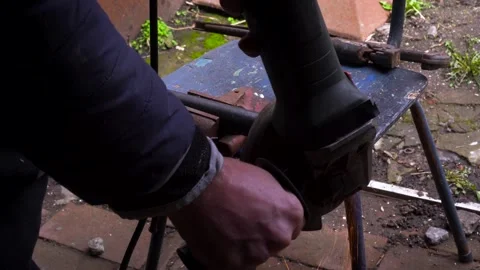 Cutting metal with a grinder Stock Footage 306782605