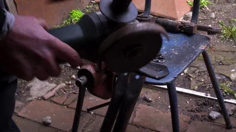 Cutting metal with a grinder Stock Footage 306782618