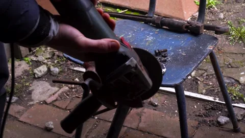 Cutting metal with a grinder Stock Footage 306782669