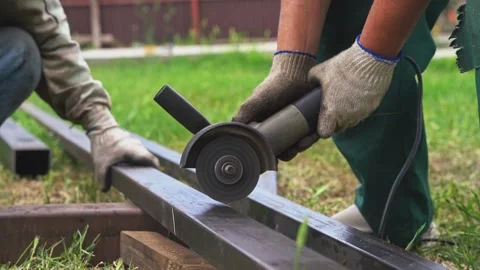 Cutting metal with a grinder Stock Footage 310871483