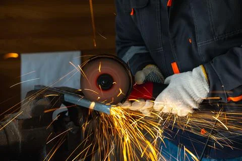 Cutting a metal part with an angle grinder Stock Photos
