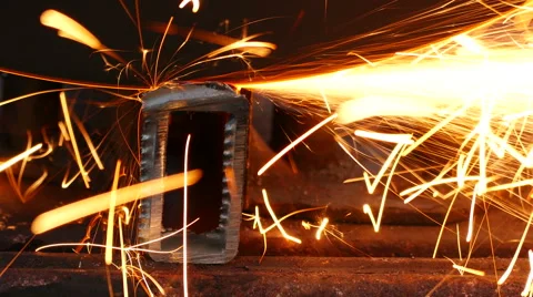 Cutting of a metal pipe with splashes of sparks Stock Footage 68852484