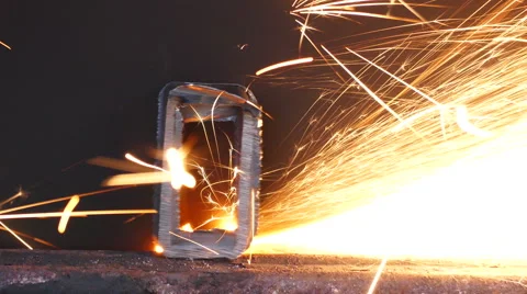 Cutting of a metal pipe with splashes of sparks Stock Footage 68855892