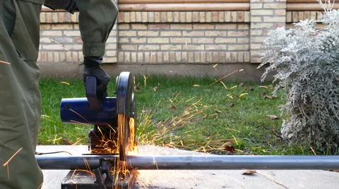 Cutting of a metal pipe with splashes of sparks Stock Footage 68855992