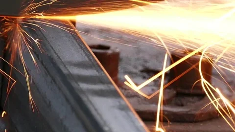 Cutting of a metal pipe with splashes of sparks, Closeup, Dolly shot Video stock 72758896