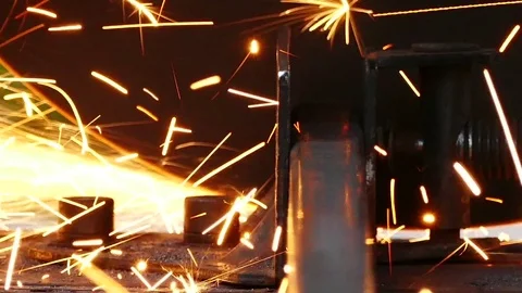 Cutting of a metal pipe with splashes of sparks, Closeup, Dolly shot Video stock 72759087
