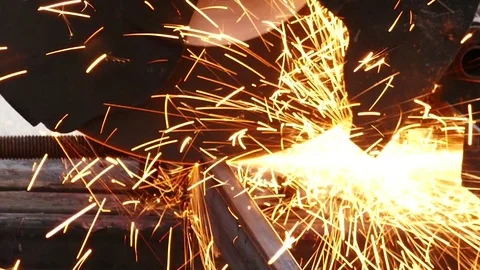 Cutting of a metal pipe with splashes of sparks, Closeup, Dolly shot Video stock 72760122