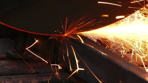 Cutting of a metal pipe with splashes of sparks, Closeup, Dolly shot Stock Footage 72760604