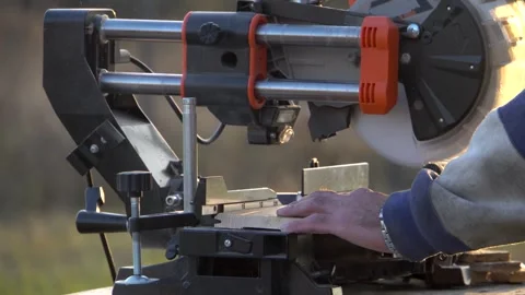 Cutting on a miter saw 4K Stock Footage 294048927