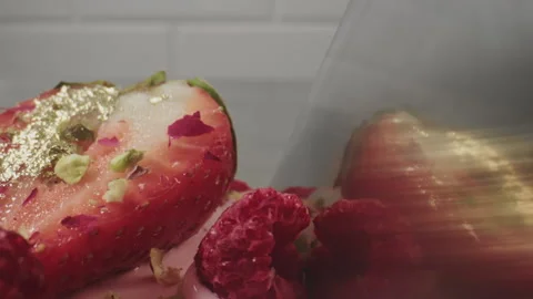 Cutting mousse cake close up. Delicious cake is cut with a knife. Fruit on top Video stock 156668068