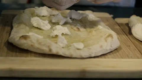 Cutting mozzarella cheese on pizza Stock Footage 86170111