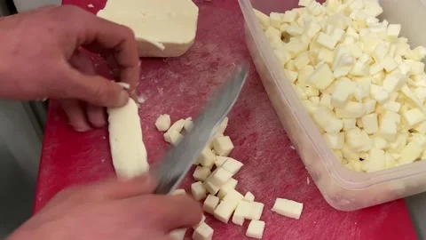 Cutting the mozzarella with a knife manually Stock Footage 236863875