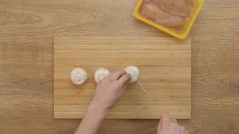 Cutting mushrooms, champignons. cooking process. top plan Video stock 164094442
