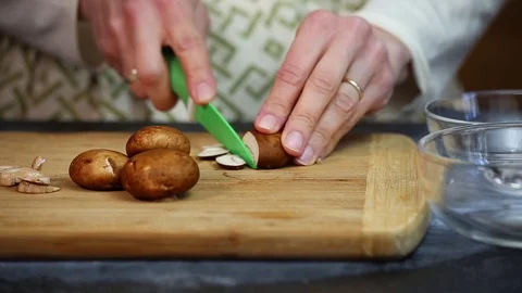 Cutting up mushrooms Stock Footage 73737864