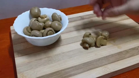 Cutting Mushrooms into Half Stock Footage 234882808