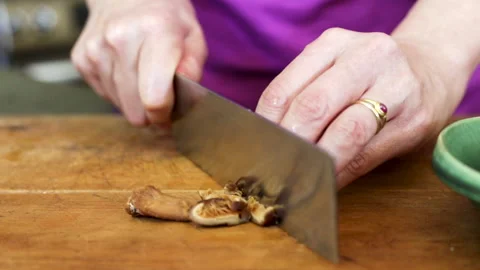 Cutting Mushrooms With A Large Knife Stock Footage 232970893