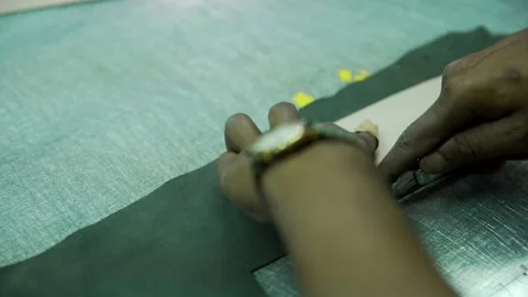Cutting nad marking black raw leather manufacturing in factory Stock Footage 202459932