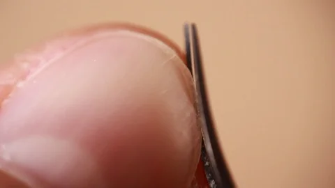 Cutting nail with manicure scissors extreme close up 動画素材 86509371