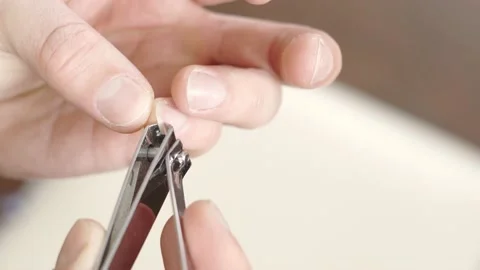 Cutting the nails on the hand with special forceps close-up on the little finger Stock Footage 149231723