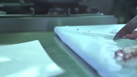 Cutting octopus with a professional knife  Stock Footage 71603878