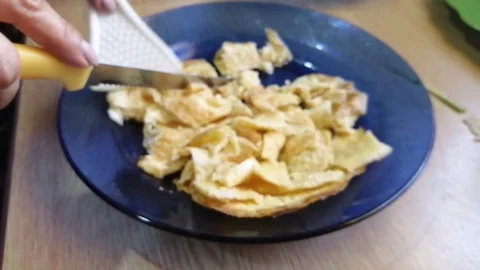 Cutting omelet Stock Footage 119847014