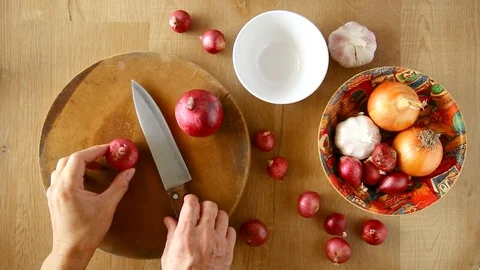Cutting an onion on cutting board Stock Footage 129537139