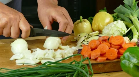 Cutting onion on desk in the kitchen Stock Footage 68064154
