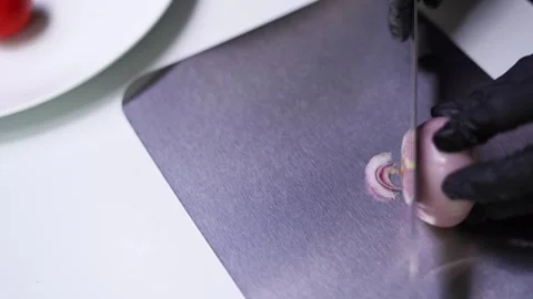 Cutting onion with knife on titanium board. sharp &amp; clean 4k food prep footage. Stock Footage 323206469