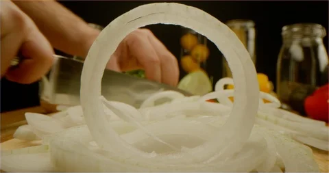 Cutting onion macro shot, pushing out of onion ring Stock Footage 126286682