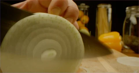 Cutting onion macro shot, pushing out of onion ring Stock Footage 126287442