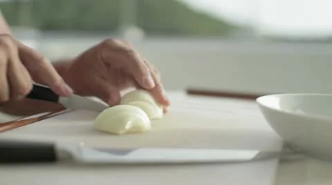 Cutting a onion into slices Stock Footage 12139328