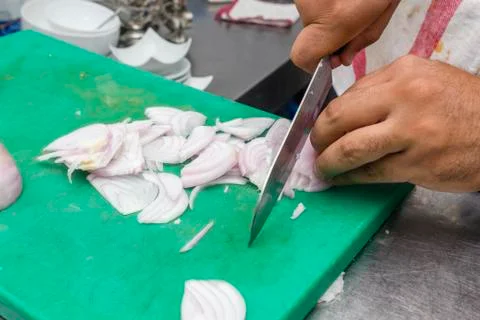 Cutting the onion into slices. Stock Photos