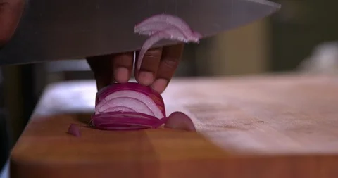 Cutting an onion in slow motion 2 Stock Footage 87846645