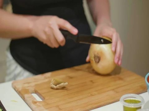 Cutting an onion in slow motion Stock Footage 80545270