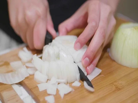 Cutting onion in slow motion Stock Footage 80562292
