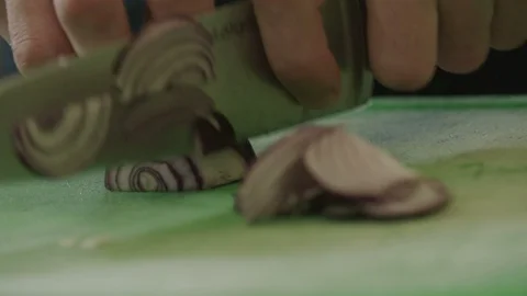 Cutting onion in slow motion Stock Footage 129016202