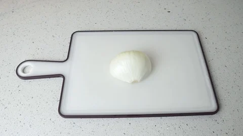 Cutting of onion on white board 스톡 동영상 109000964