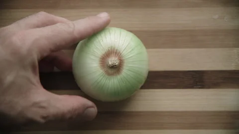 Cutting onions on a cutting board Stock Footage 132217676