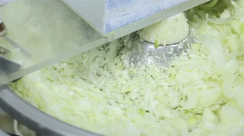 Cutting Onions in machine. Stock Footage 61878450