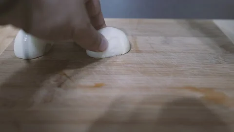 Cutting onions with a sharp knife Stock Footage 132456748