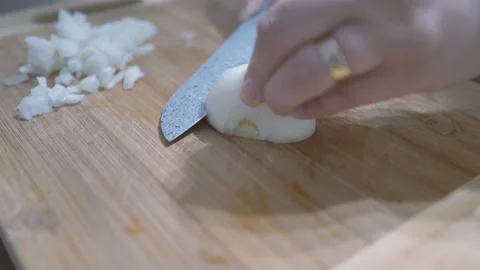 Cutting onions with a sharp knife Stock Footage 132456796