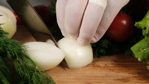 Cutting onions on table Stock Footage 199135364